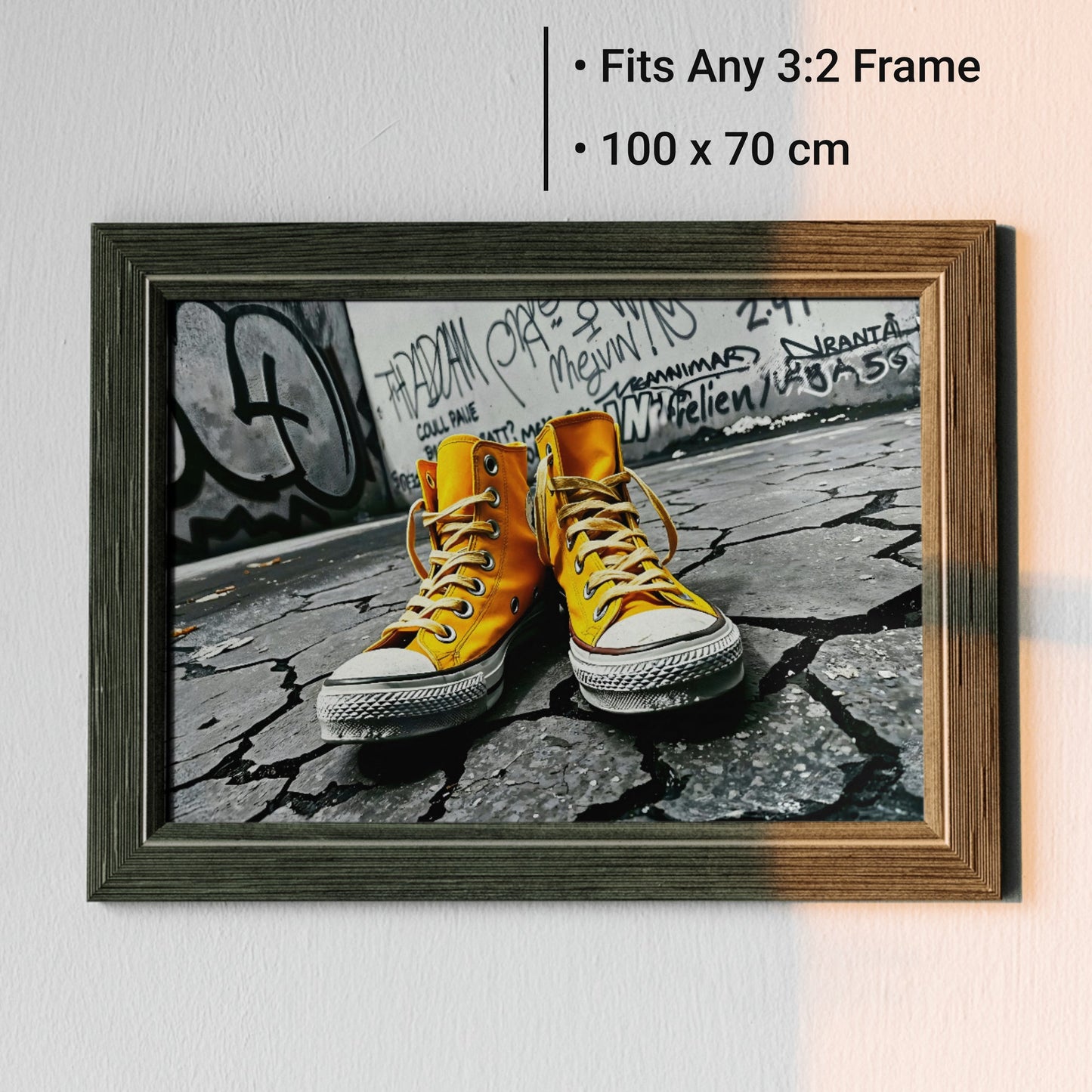 Urban Yellow - Arts To GloryUrban YellowDigital Wall ArtArts To GloryFramed digital print of vibrant yellow trainers set against a monochrome graffiti street scene, ideal statement piece for interiors.
