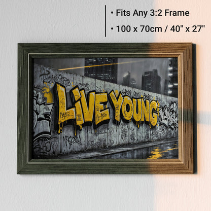 Live Young Graffiti | Bold Urban Wall Art | Street Art Digital Print | Yellow Accent | Modern Urban Décor | 100 x 70 cm - Arts To GloryLive Young Graffiti | Bold Urban Wall Art | Street Art Digital Print | Yellow Accent | Modern Urban Décor | 100 x 70 cmTextual NarrativesArts To GloryUrban framed wall art showcasing bold graffiti - style text in an urban cityscape, designed to fit any 3:2 frame, 100x70cm, ideal for modern home décor.