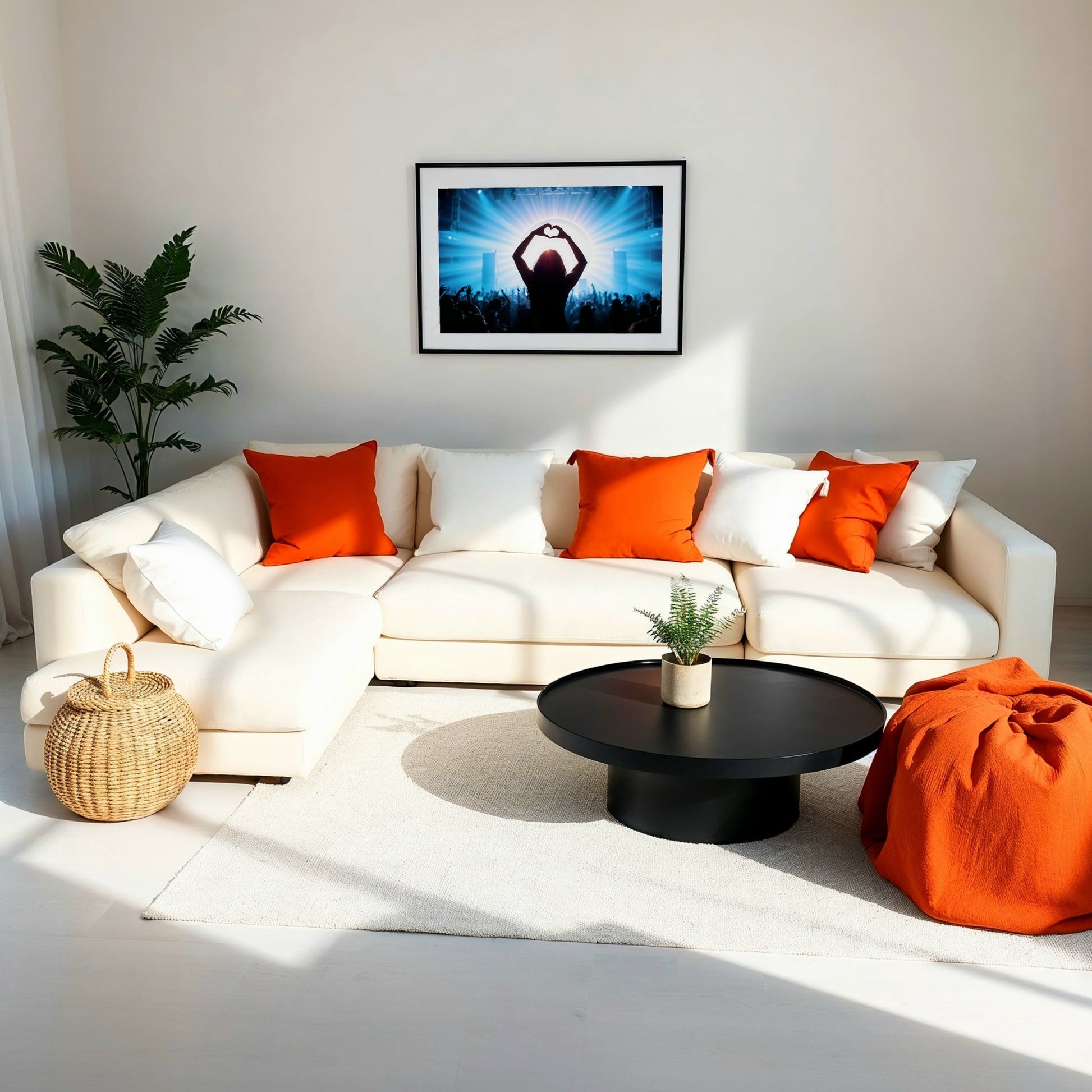 Music Festival Heart Silhouette - Arts To GloryMusic Festival Heart SilhouetteDigital Wall ArtArts To GloryA minimalistic living room featuring a neutral sofa, bold cushions, and framed artwork of a heart gesture silhouette in blue light.