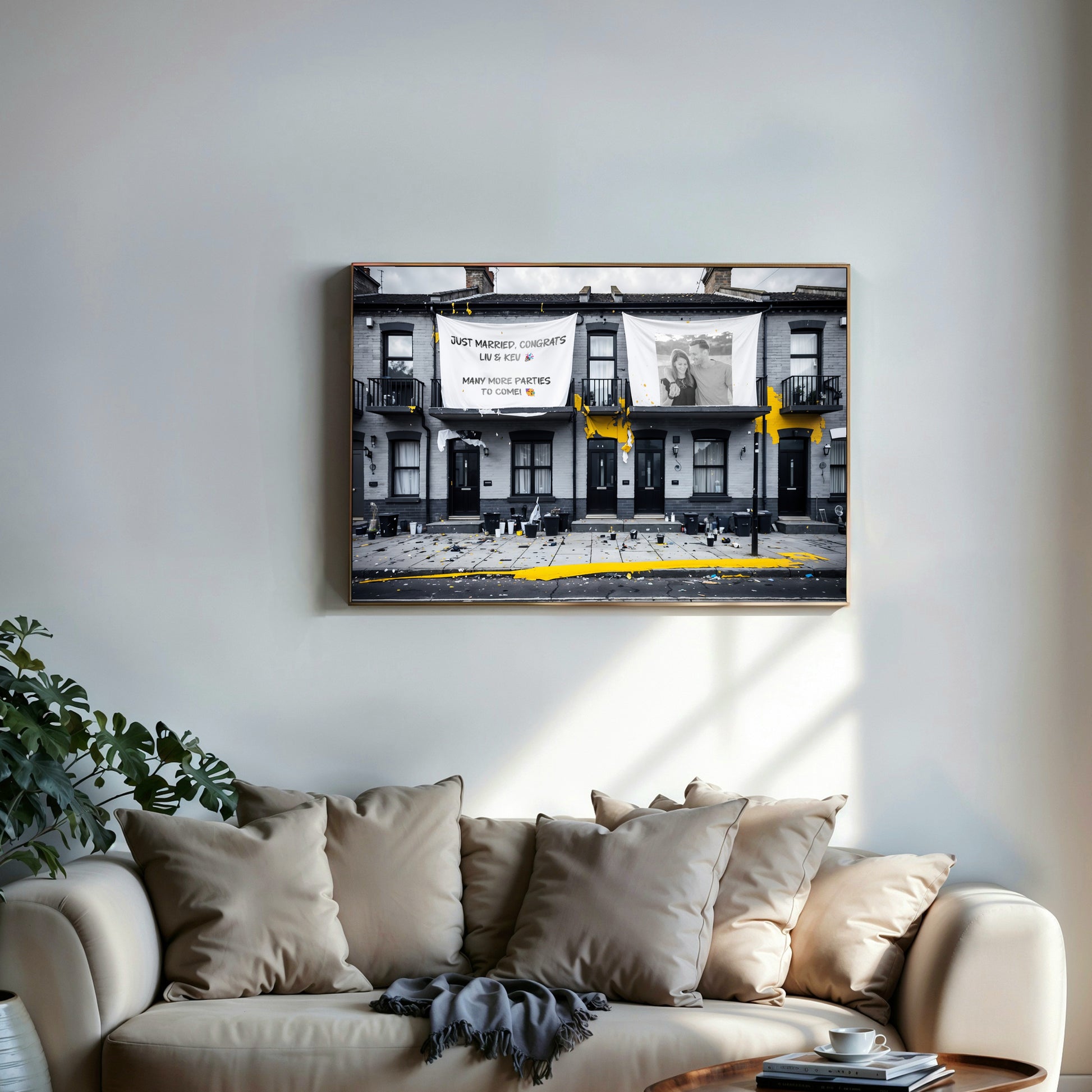 Personalised urban art print depicting the morning after a house party, with customizable text and images, featuring black and yellow accents, displayed above a modern sofa in a stylish living room.