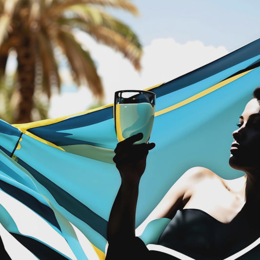woman drinking cocktail on a hammock