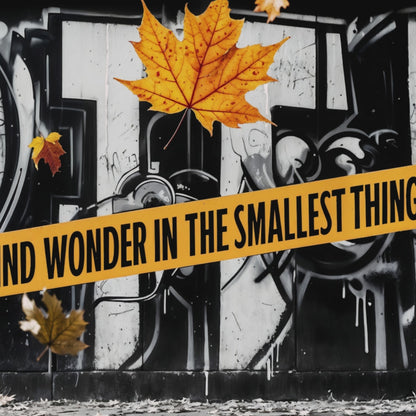Video showcasing a close-up view of urban graffiti art with vibrant autumn leaves and the text "Find Wonder in the Smallest Things," ideal for modern décor.