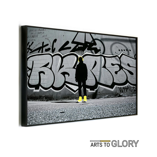 Silhouette Streetwear - Arts To GlorySilhouette StreetwearDigital Wall ArtArts To GlorySilhouetted streetwear figure with yellow headphones and boots in front of graffiti wall – modern urban digital art by Arts To Glory.