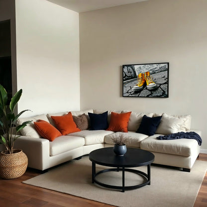 Urban Yellow - Arts To GloryUrban YellowDigital Wall ArtArts To GloryModern living space featuring cream sectional sofa with colourful cushions, wooden flooring, and framed urban street art print of vibrant yellow trainers.