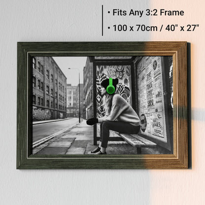 Woman Wearing Green Headphones at Bus Stop - Arts To GloryWoman Wearing Green Headphones at Bus StopDigital Wall ArtArts To GloryDigital art featuring a contemplative woman wearing green headphones at a graffiti - adorned bus stop, 100x70cm.