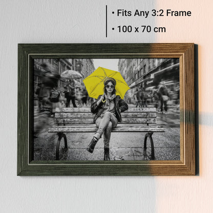 Yellow Umbrella Portrait - Arts To GloryYellow Umbrella PortraitDigital Wall ArtArts To GloryAngled framed mock - up of urban umbrella portrait artwork with clear 100 x 70 cm size labels, set against a white background for scale reference.